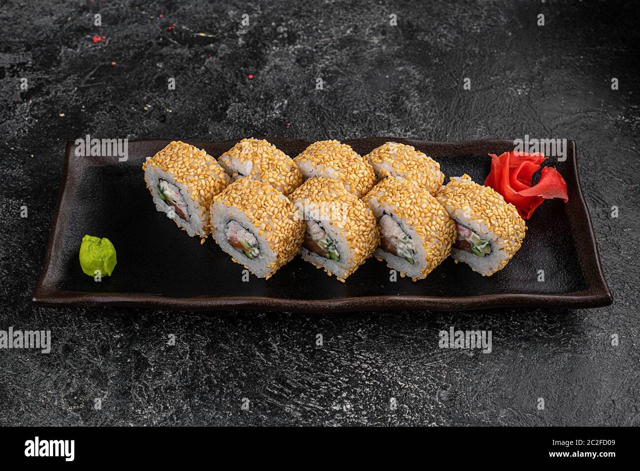 Sushi ingredients, nori seaweed on makisu bamboo mat for rolling, fresh raw  salmon, raw sushi rice, soy sauce and chopsticks on the side Stock Photo -  Alamy