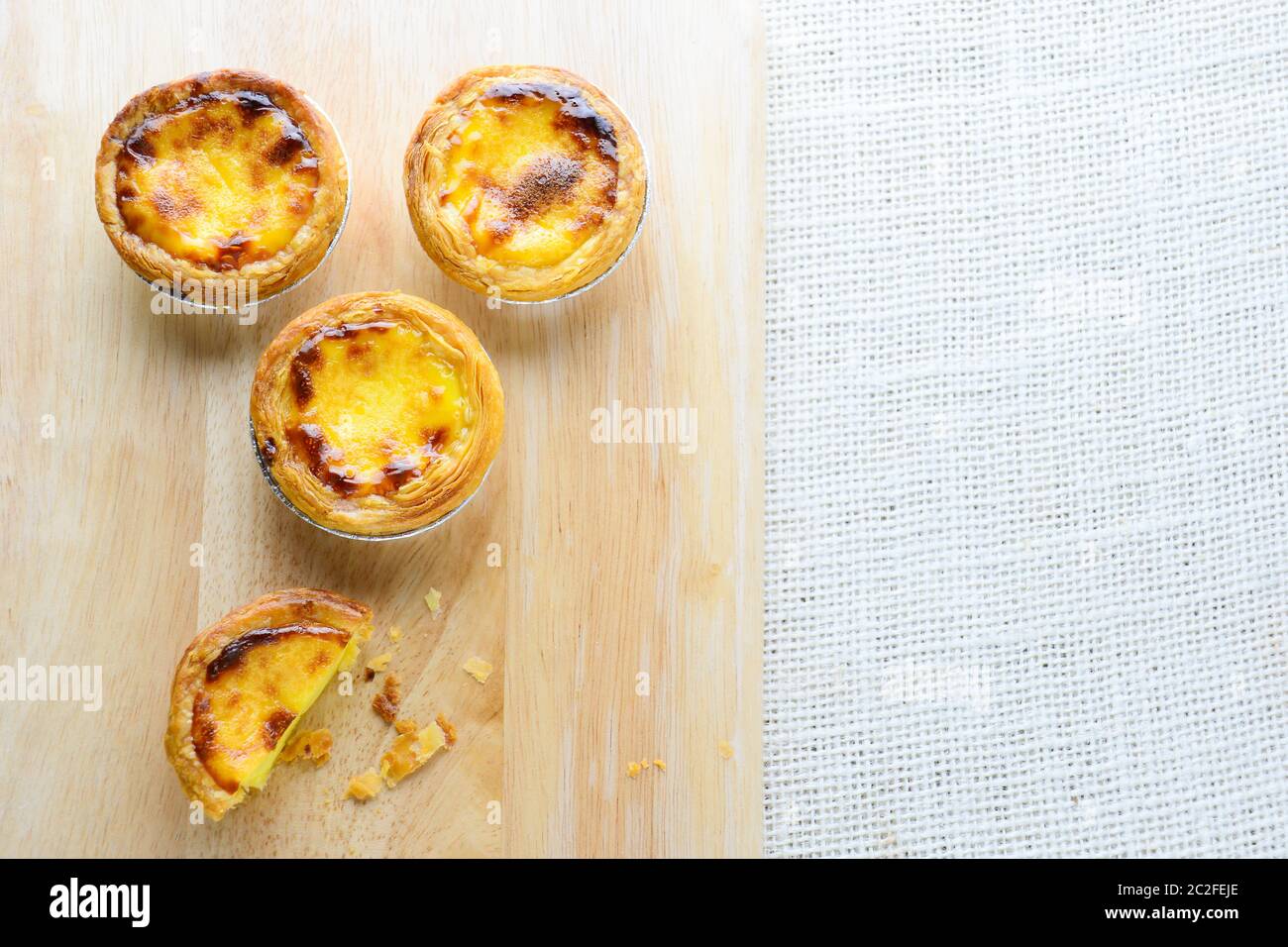 Portuguese Egg Tarts, is a kind of custard tart found in various Asian countries. The dish consists of an outer pastry crust and Stock Photo