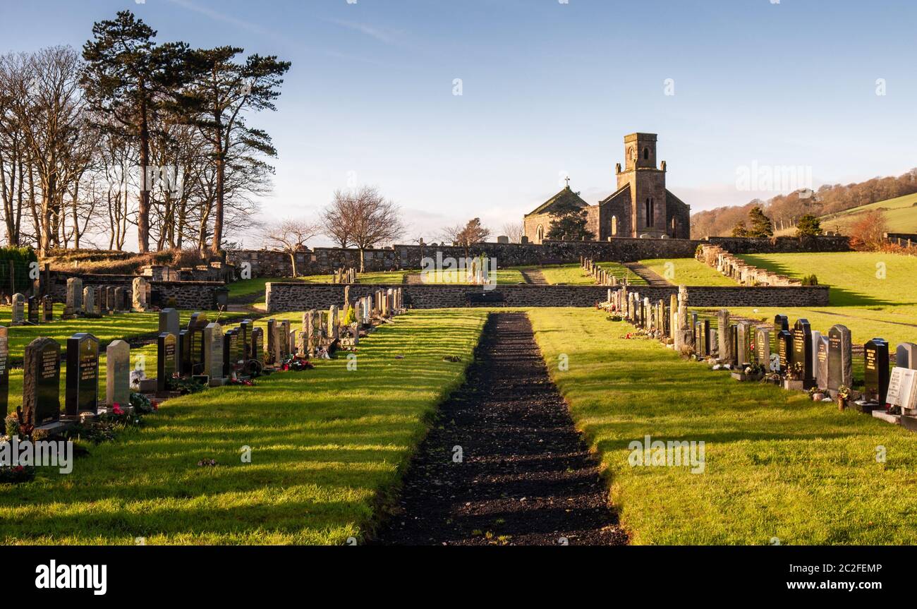 Bute, Scotland, UK - January 12, 2012: Winter sun shines on the roofless ruin of St Colmac's Church and gravestones of the cemetery on Scotland's Isle Stock Photo