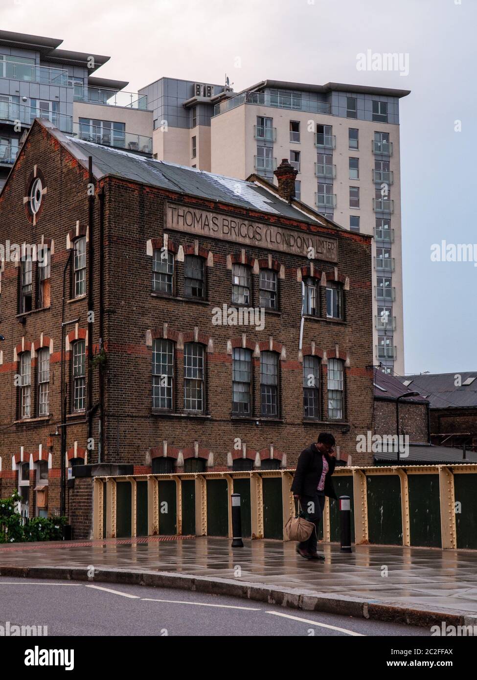 London, England, UK - July 13, 2010: An old warehouse building and modern apartment buildings are juxtaposed on Southgate Road in Hackney, North Londo Stock Photo
