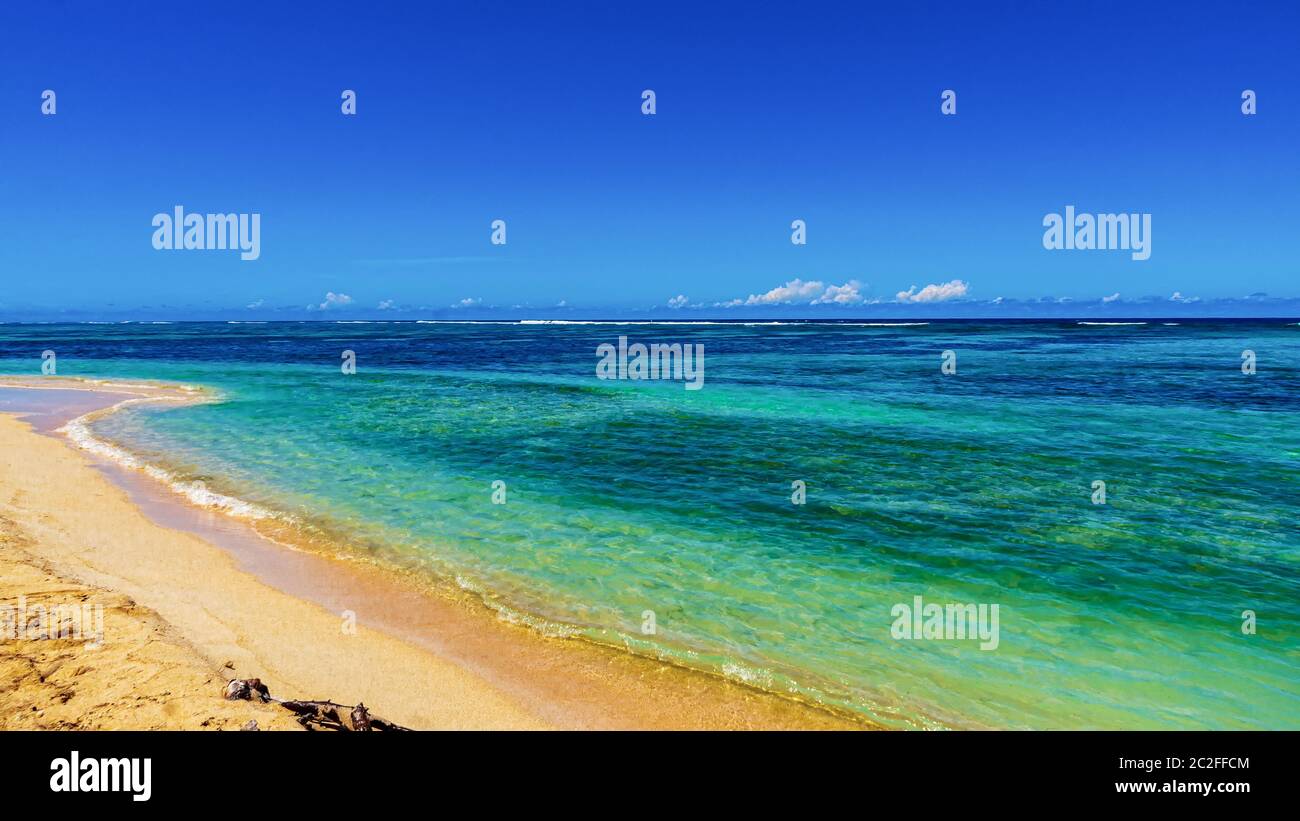 sea coast view, yellow sand, blue sky with clouds Stock Photo