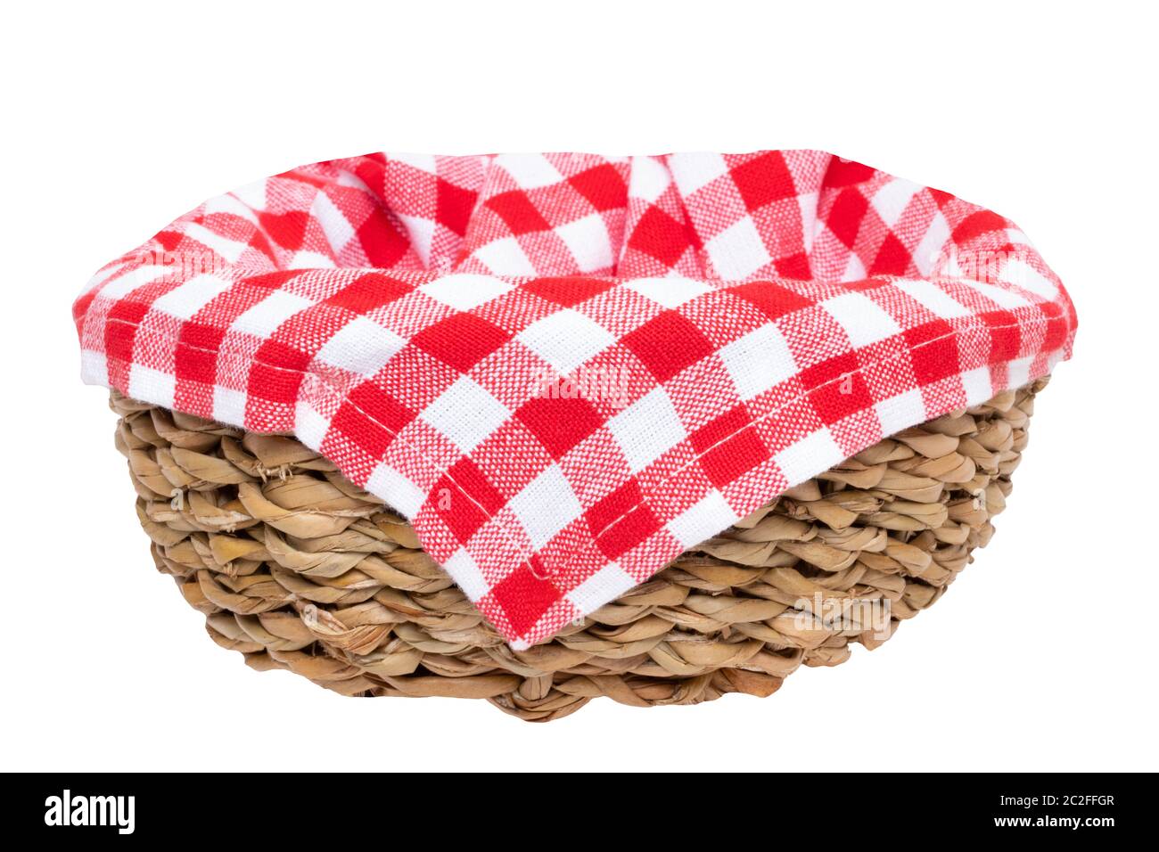 Empty picnic basket. Closeup of a empty straw basket therein a red