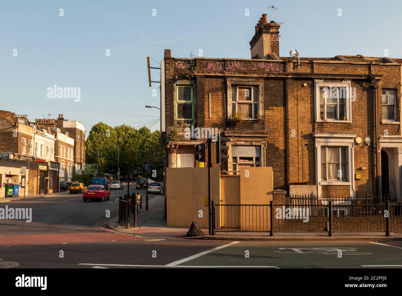 London, England, UK - June 28, 2010: A derelict house stands boarded up on the New Cross Road in South East London following the 'credit crisis' reces Stock Photo