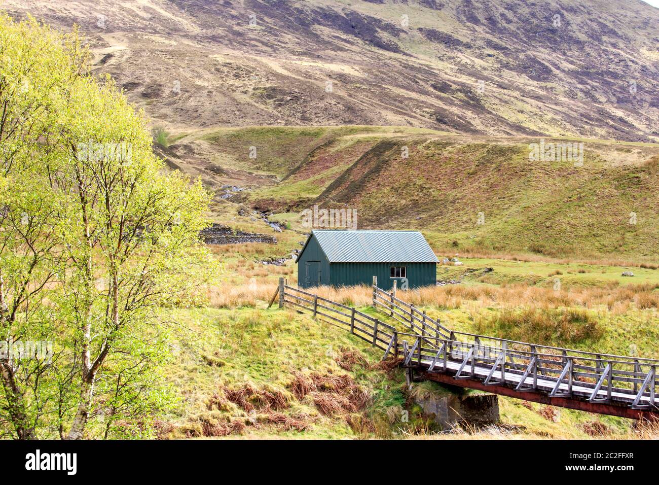View down Glen Roy with two old buildings in the distant the Scottish highland Stock Photo