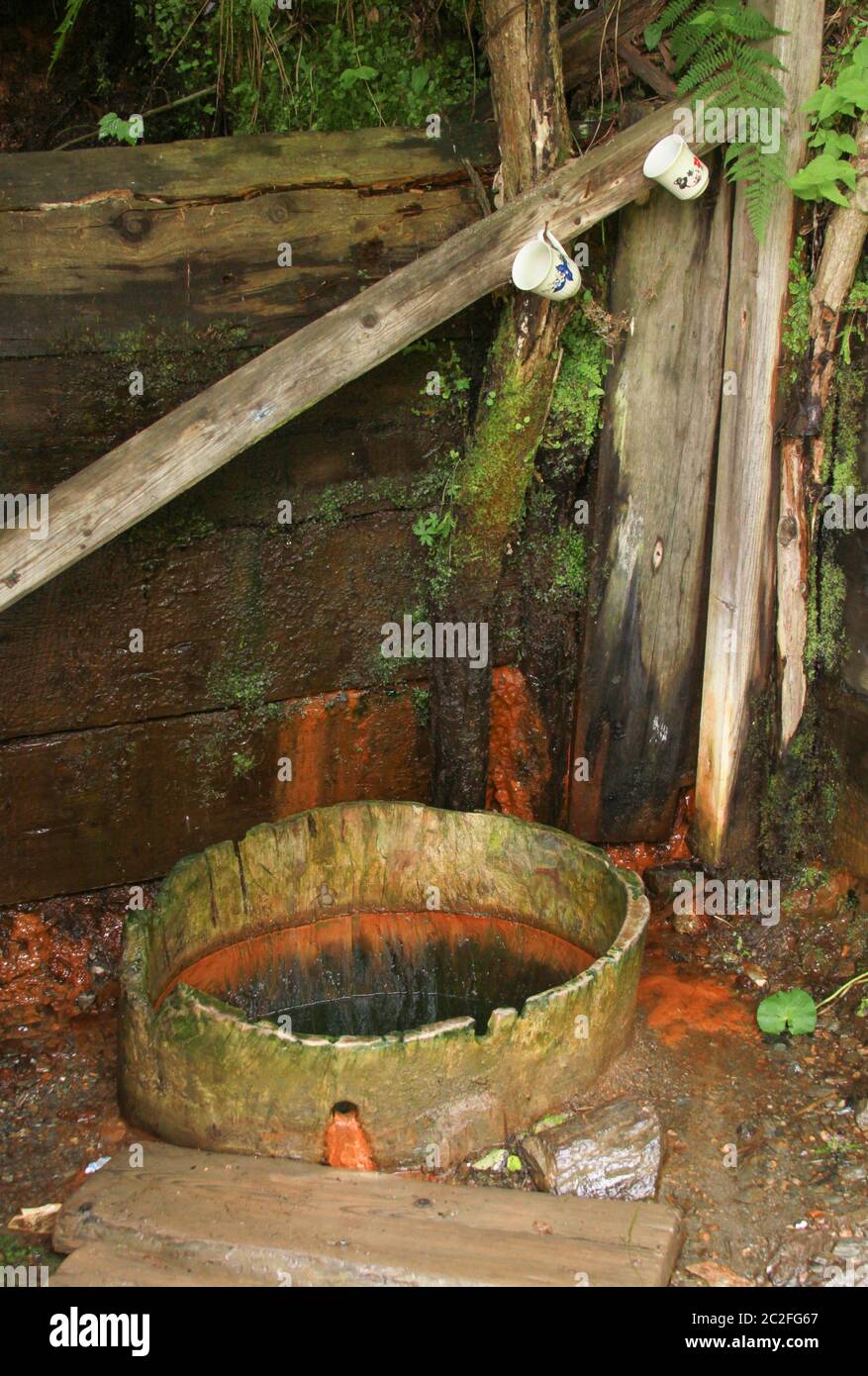 Borviz well. Natural iron rich mineral water well in Romania Stock Photo