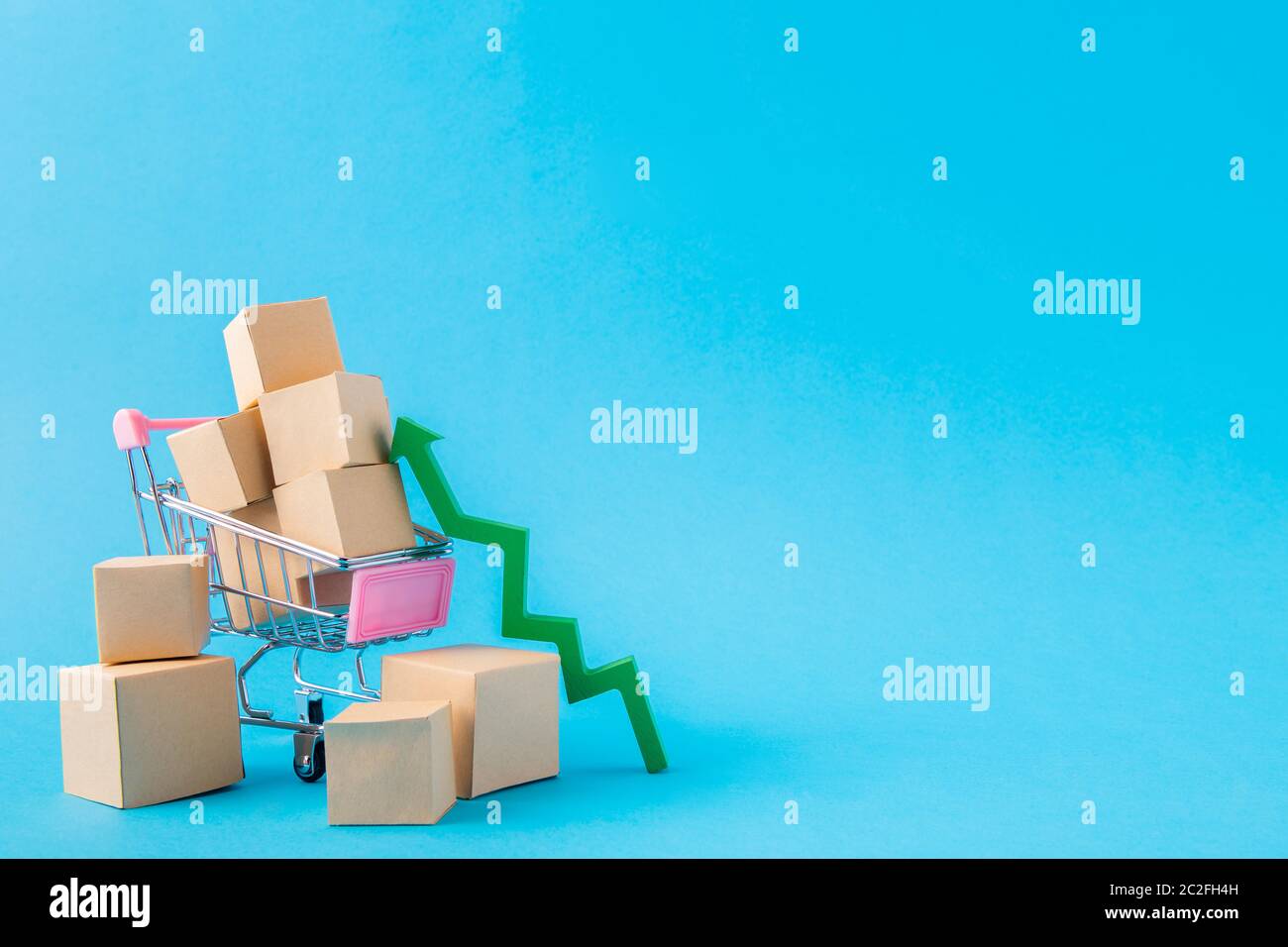 Picture of shopping cart carrying large parcels arrow going up