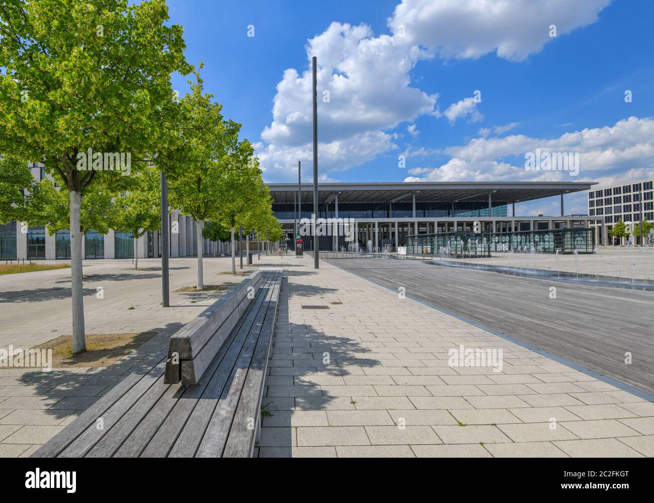 17 June 2020, Brandenburg, Schönefeld: Linden trees stand in front of the terminal of the capital airport Berlin Brandenburg Willy Brandt (BER). According to the operator, there is nothing to stop the planned opening of the new Capital Airport BER in October 2020. After years of delays, BER is scheduled to start operations at the end of October 2020. The operating company is owned by the states of Berlin and Brandenburg and the federal government. Photo: Patrick Pleul/dpa-Zentralbild/ZB Stock Photo
