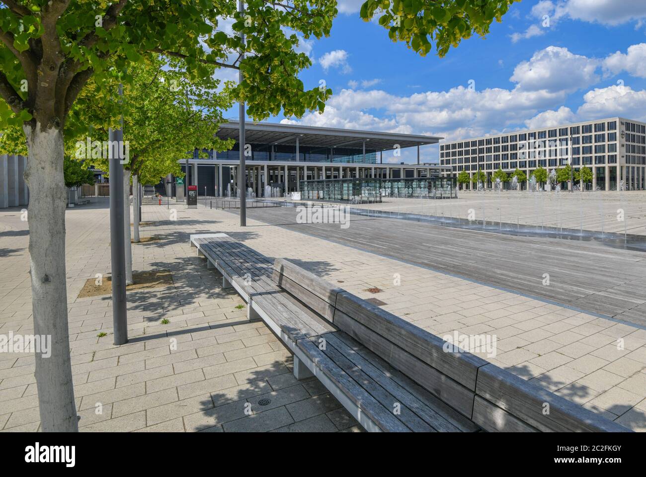 17 June 2020, Brandenburg, Schönefeld: Linden trees stand in front of the terminal of the capital airport Berlin Brandenburg Willy Brandt (BER). According to the operator, there is nothing to stop the planned opening of the new Capital Airport BER in October 2020. After years of delays, BER is scheduled to start operations at the end of October 2020. The operating company is owned by the states of Berlin and Brandenburg and the federal government. Photo: Patrick Pleul/dpa-Zentralbild/ZB Stock Photo