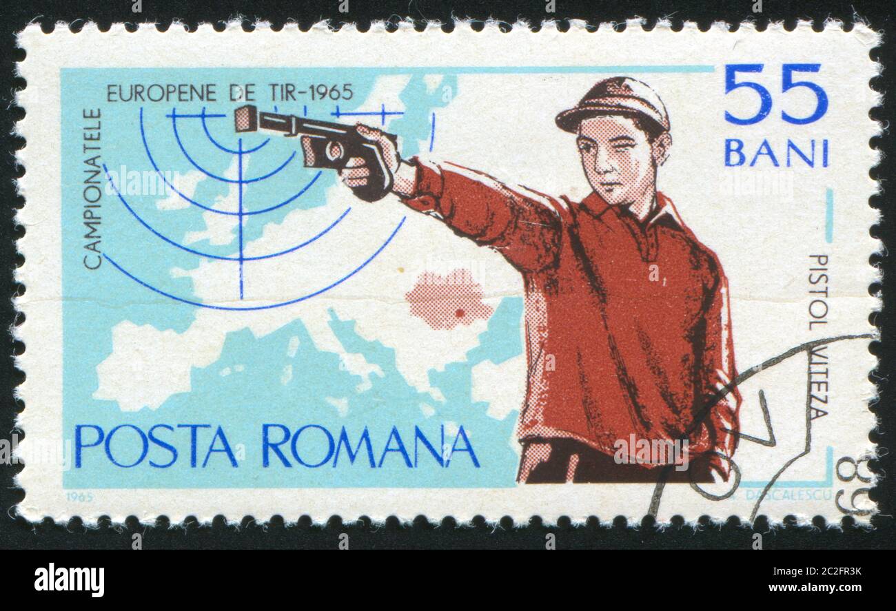 ROMANIA - CIRCA 1965: stamp printed by Romania, shows Rapid-fire pistol and map of Europe, circa 1965 Stock Photo