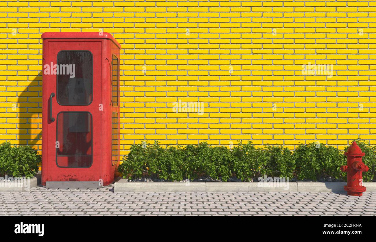 Single old red phone booth in retro style on the footpath in the urban exterior opposite the facade of the yellow brick wall and red fire hydrant. 3D Stock Photo