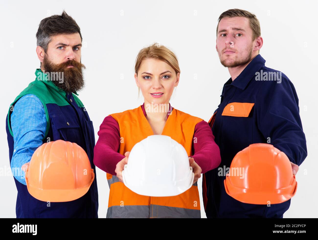 Safety and protection concept. Men and woman wears uniform and holds ...