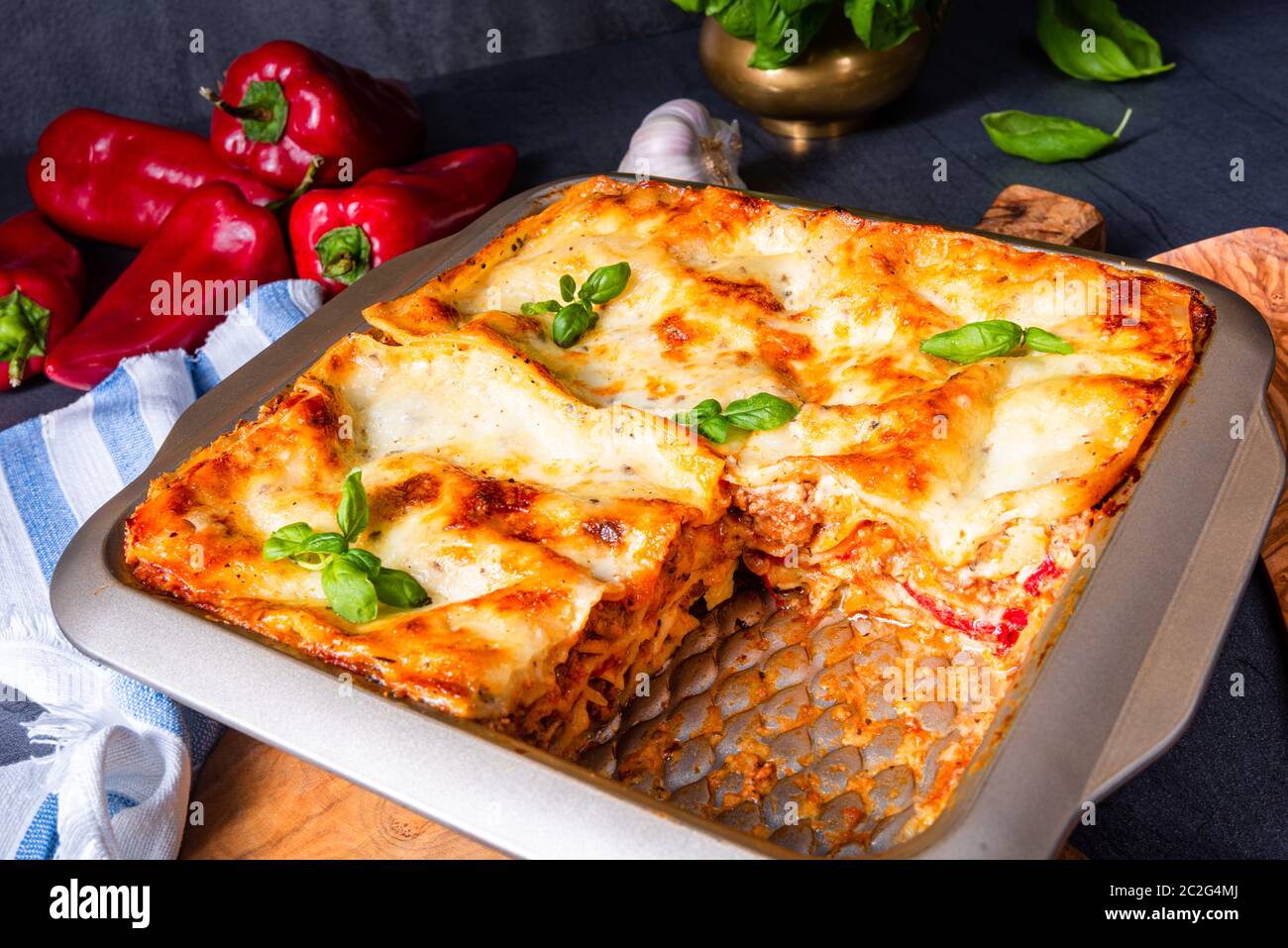 rustic spicy lasagne with basil on the tin Stock Photo Alamy
