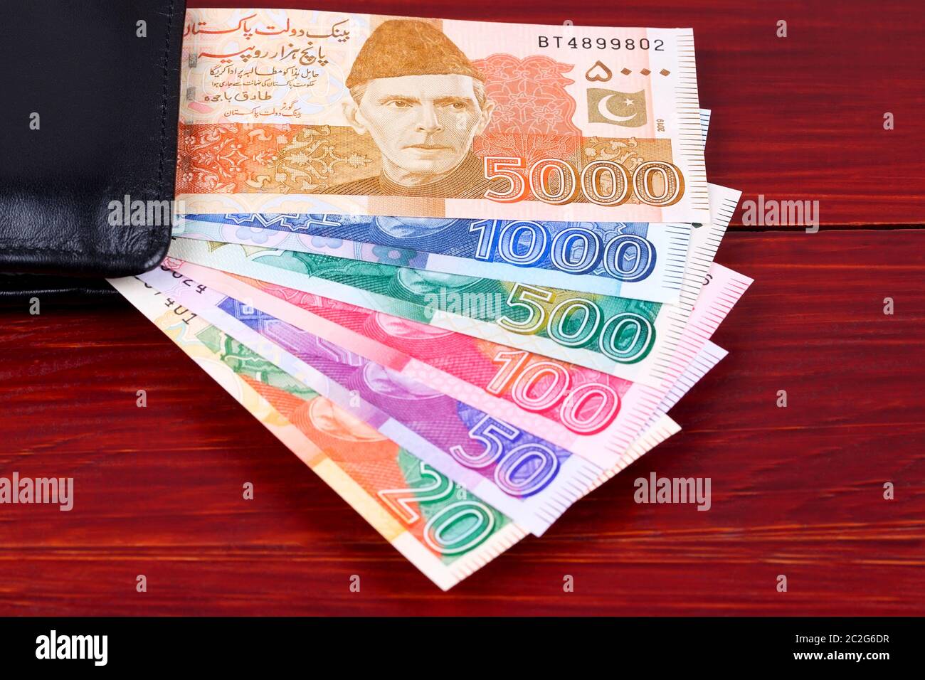 Pakistani Rupee in the black wallet Stock Photo