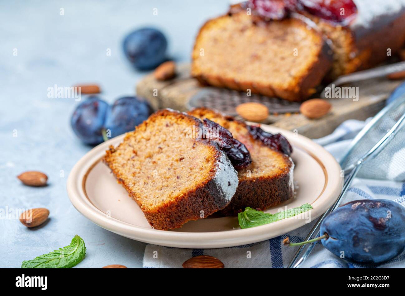 Slices of traditional plum cake on ceramic plate. Stock Photo