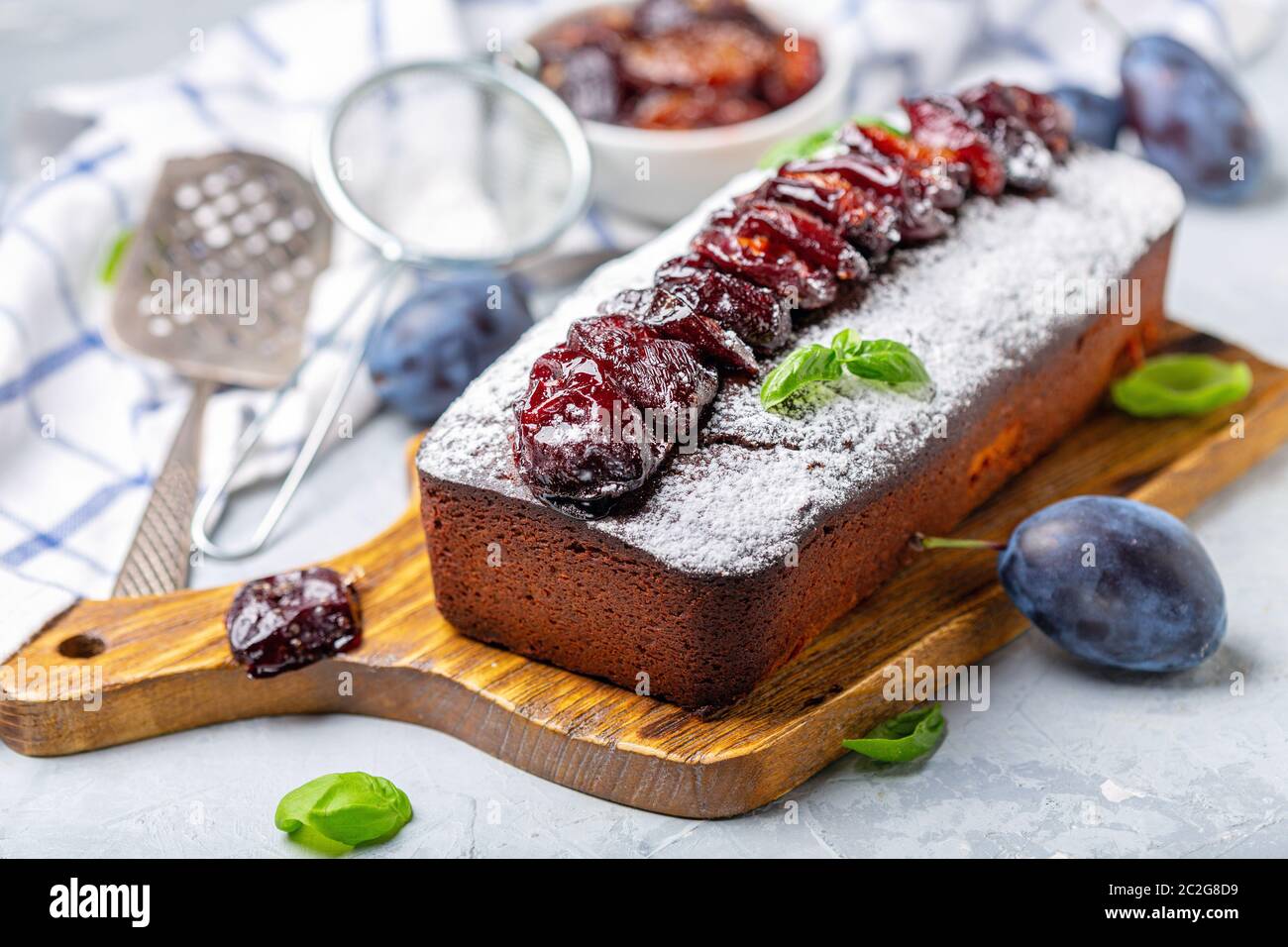 Cake with spiced plums. Stock Photo