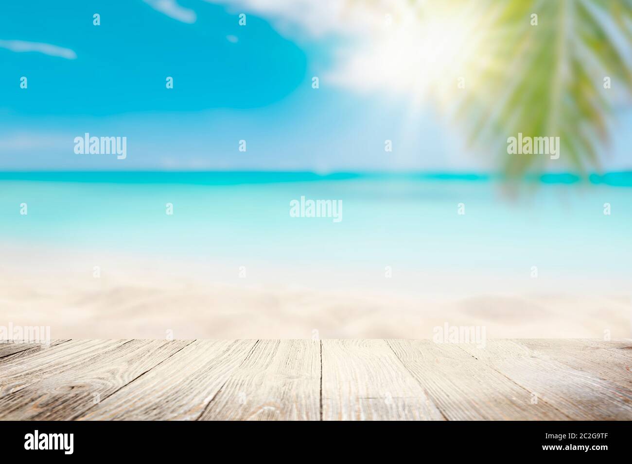 Sunny tropical Caribbean beach with palm trees and turquoise water Stock Photo