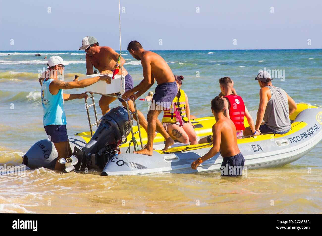 3 October 2018 A Rib pleasure craft filled with tourists coming ashore at the Oura Prai beach in Albufia on the Algarve Portugal Stock Photo
