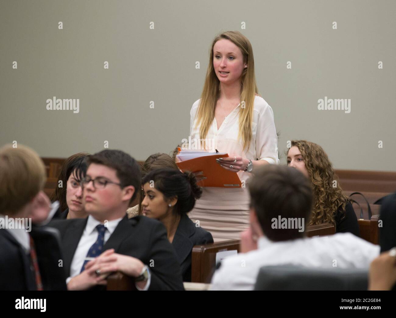 San Marcos, Texas USA, February 27, 2016: Dripping Springs High School student stands to make a statement during a mock trial in a county courtroom that highlights the dangers of dating abuse and unhealthy relationships. The two-hour trial dramatized legal action related to a toxic relationship between a young unmarried couple. © Bob Daemmrich Stock Photo