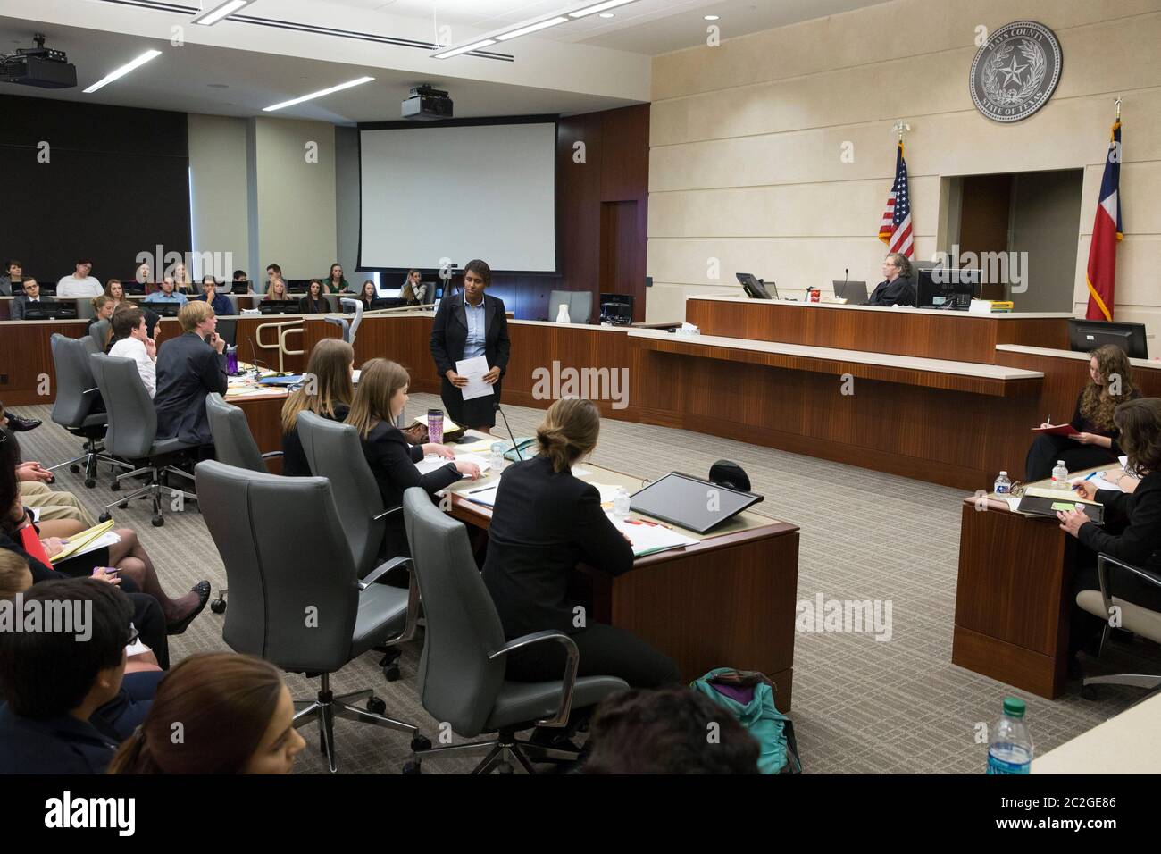 San Marcos, Texas USA, February 27, 2016: Dripping Springs High School student poses as prosecuting attorney during a mock trial in a county courtroom that highlights the dangers of dating abuse and unhealthy relationships. The two-hour trial dramatized legal action related to a toxic relationship between a young unmarried couple. © Bob Daemmrich Stock Photo