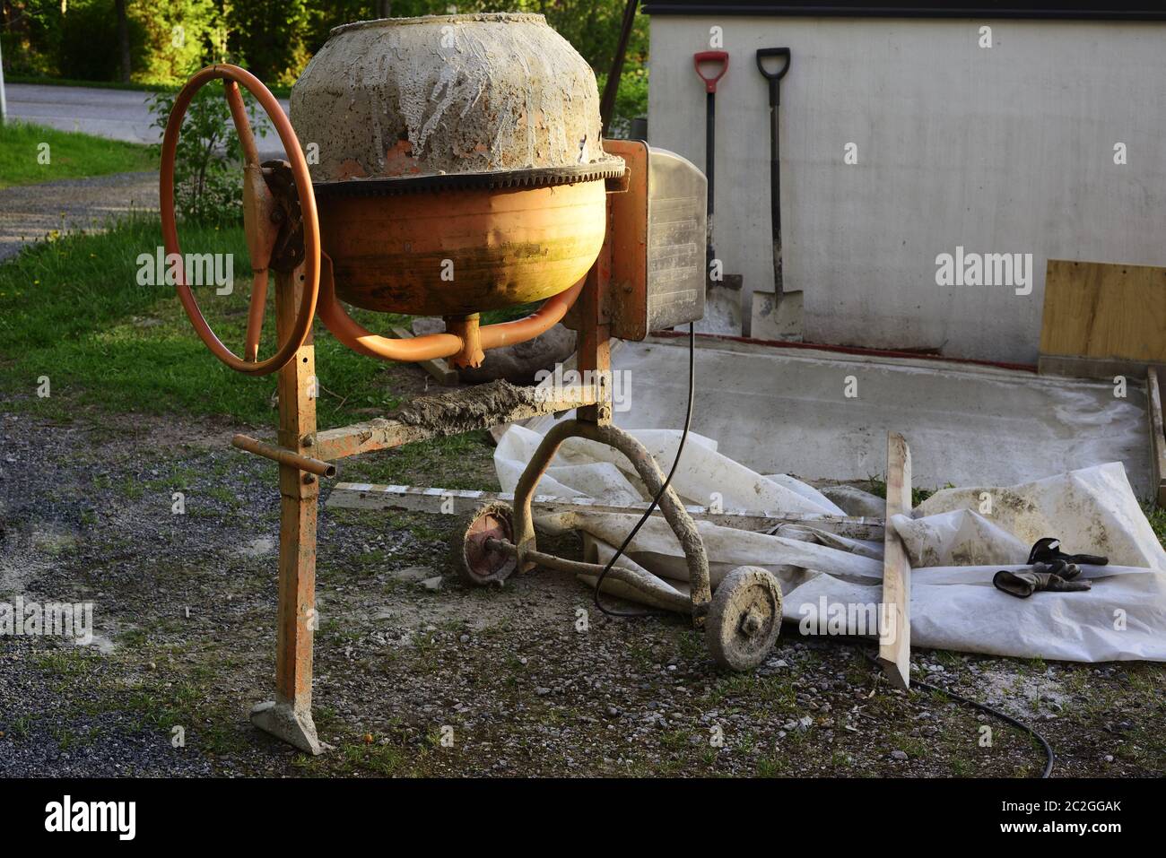 cement mixers and tools in the yard Stock Photo