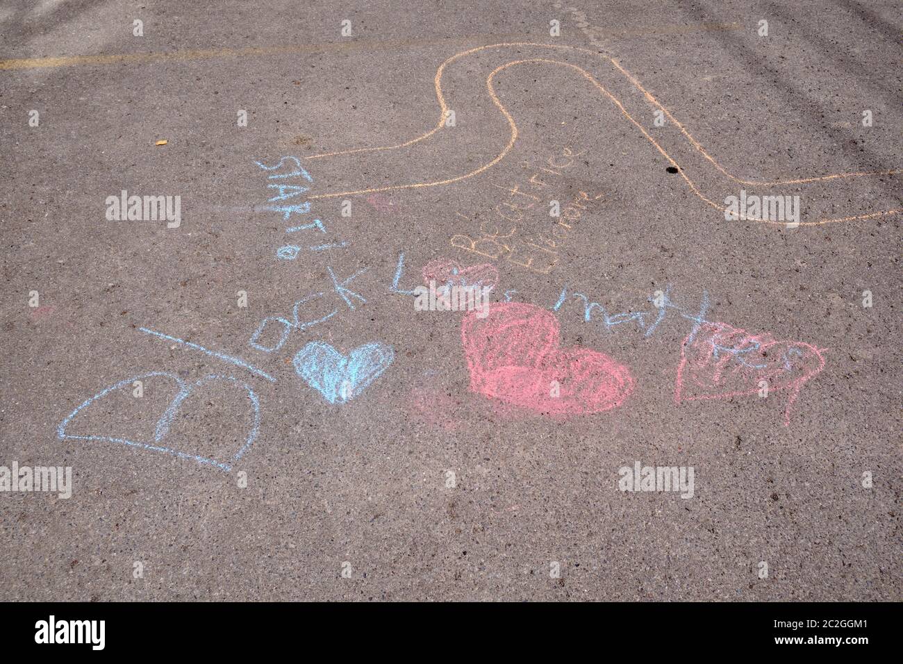 Black Lives Matter with hearts written in Chalk on a sidewalk in The Glebe area of Ottawa, Canada Stock Photo