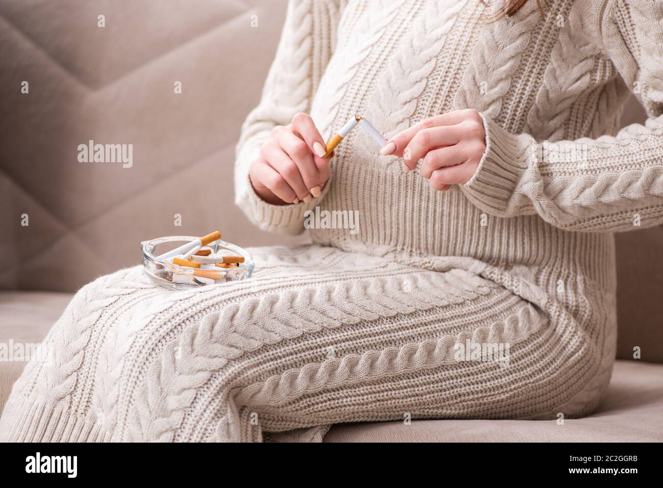 Man and pregnant woman in the antismoking concept Stock Photo