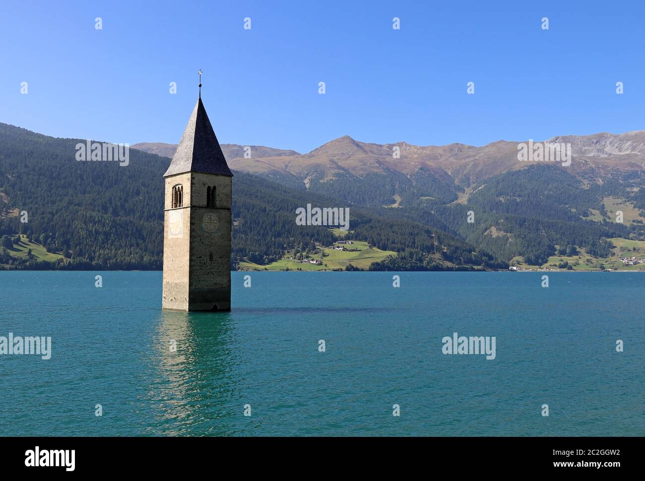 The sunken church tower in the Reschensee in Italy Stock Photo