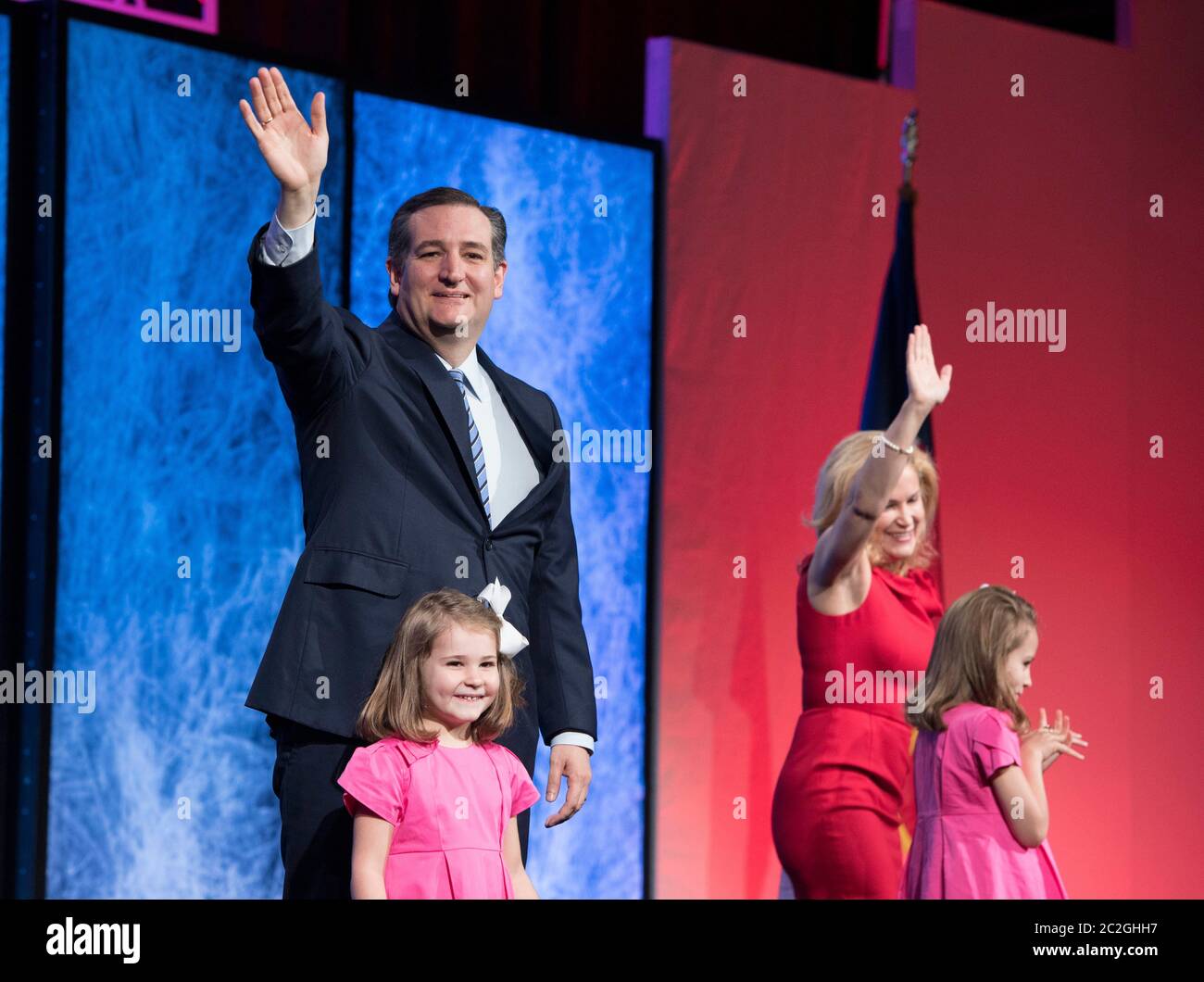 Dallas Texas USA, May 14 2016: U.S. Senator Ted Cruz of Texas waves to an adoring crowd as his wife and young daughters join him onstage at the Republican Party of Texas Convention. ©Bob Daemmrich Stock Photo