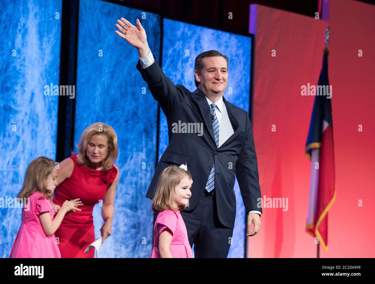 Dallas Texas USA, May 14 2016: U.S. Senator Ted Cruz of Texas waves to an adoring crowd as his wife and young daughters join him onstage at the Republican Party of Texas Convention. ©Bob Daemmrich Stock Photo