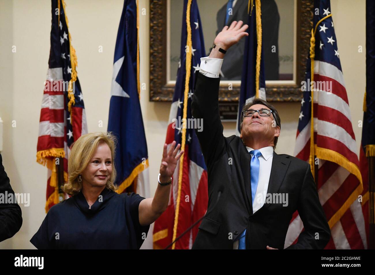 Austin Texas USA, May 6, 2016: Former Texas Governor Rick Perry, with wife and former first lady Anita Perry on the left, is honored as his official portrait is unveiled in ceremonies at the Texas Capitol. Perry, the 47th governor of Texas, was in office for 14 years after George W. Bush rose to the U.S. presidency in 2001.   ©Bob Daemmrich Stock Photo