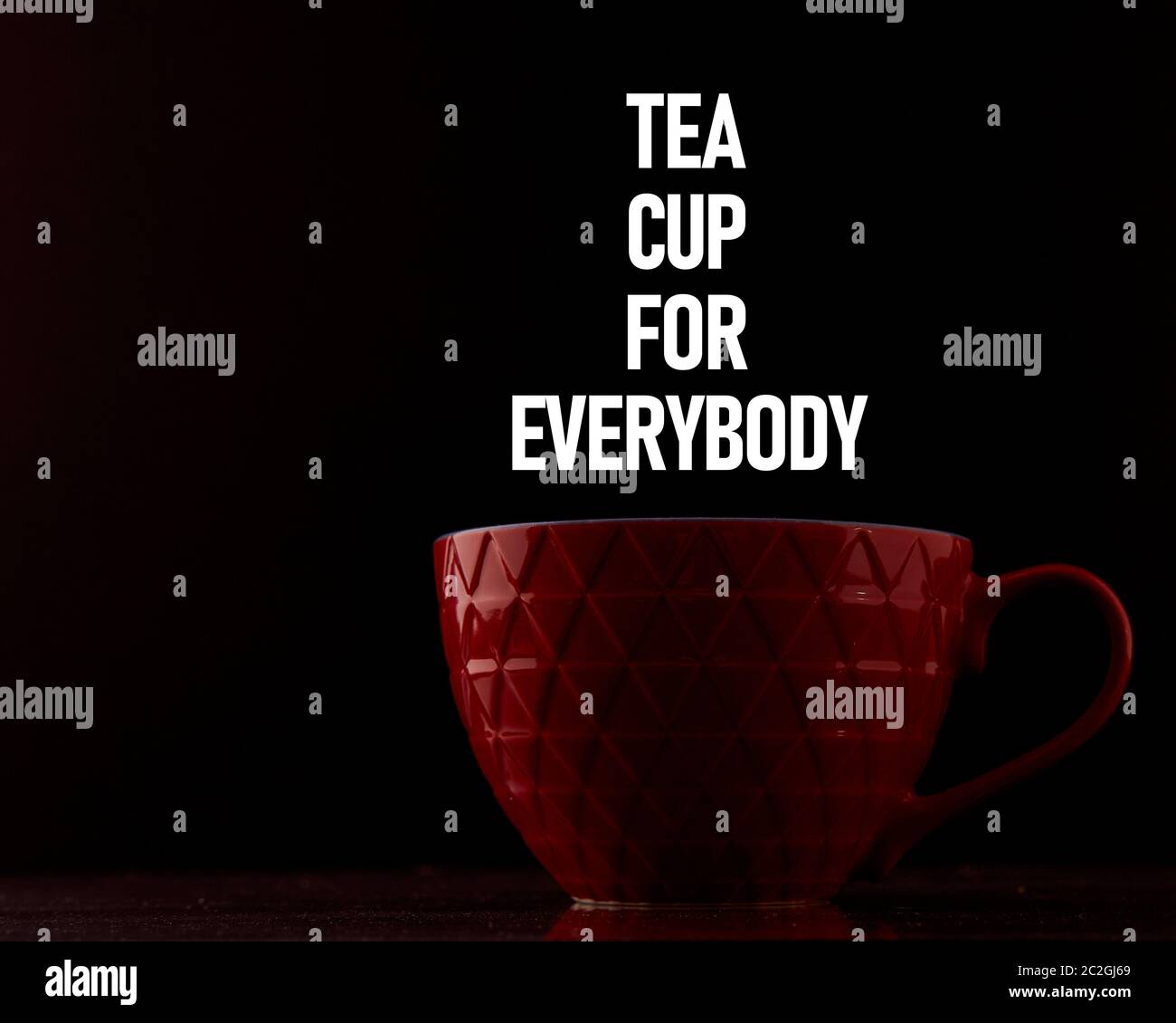 red mug on a black background with inscriptions. Design layout Stock Photo