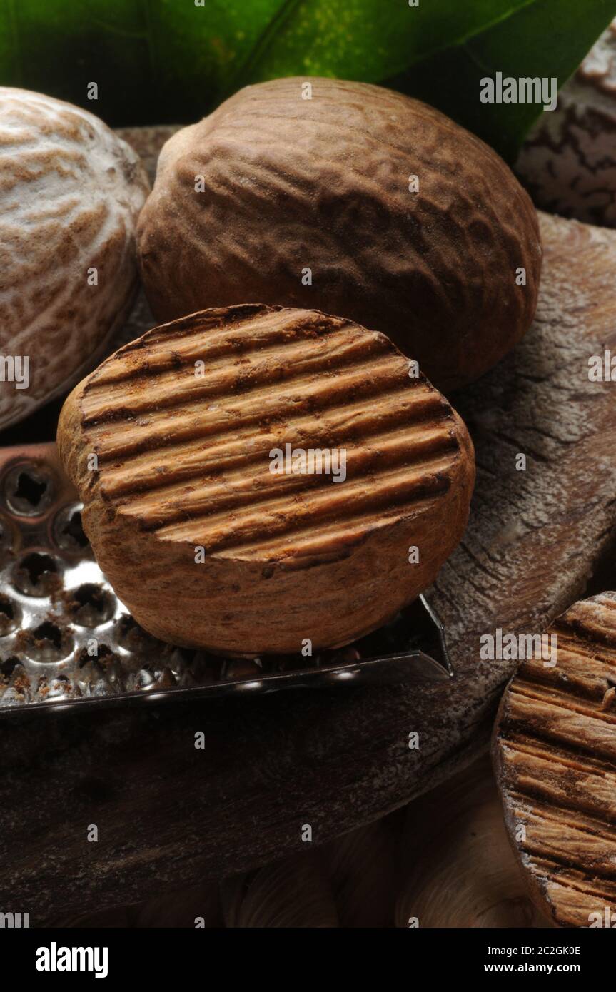 Closeup of nutmegs with grater Stock Photo