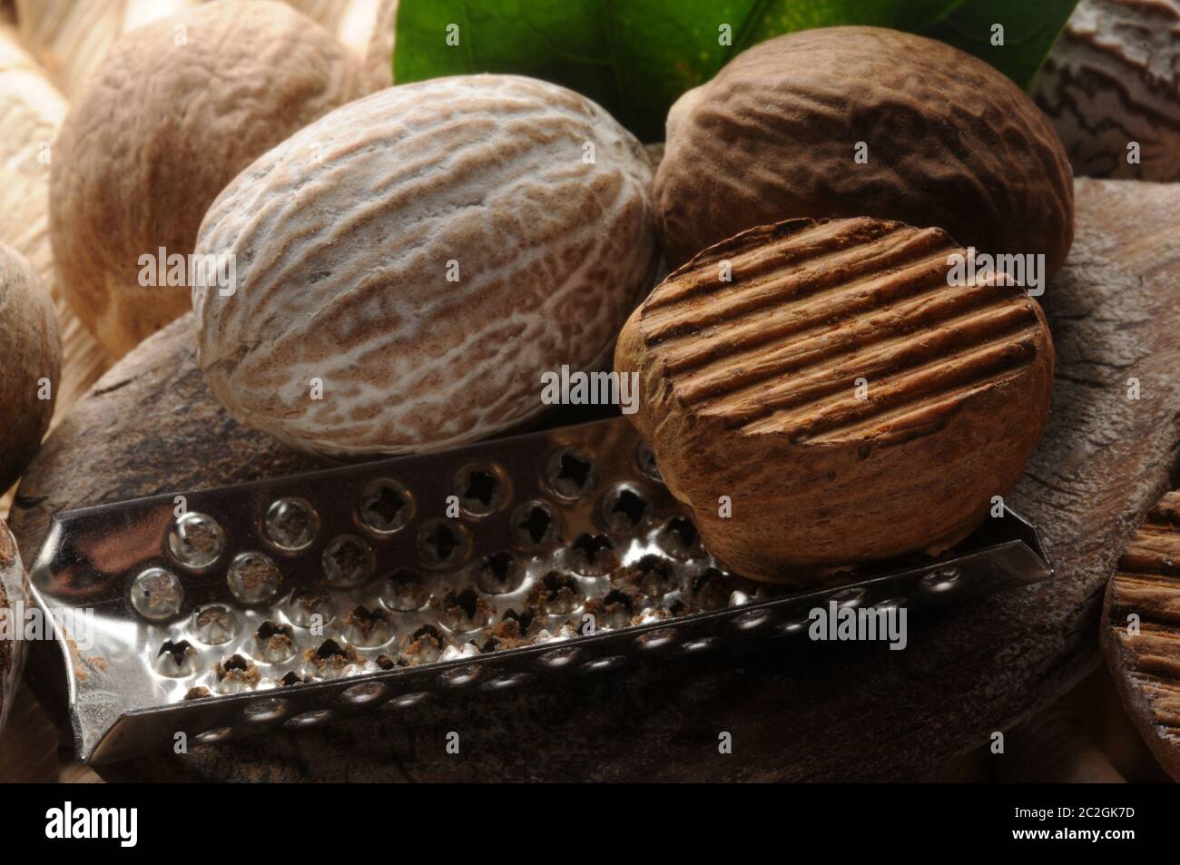 Closeup of nutmegs with grater Stock Photo