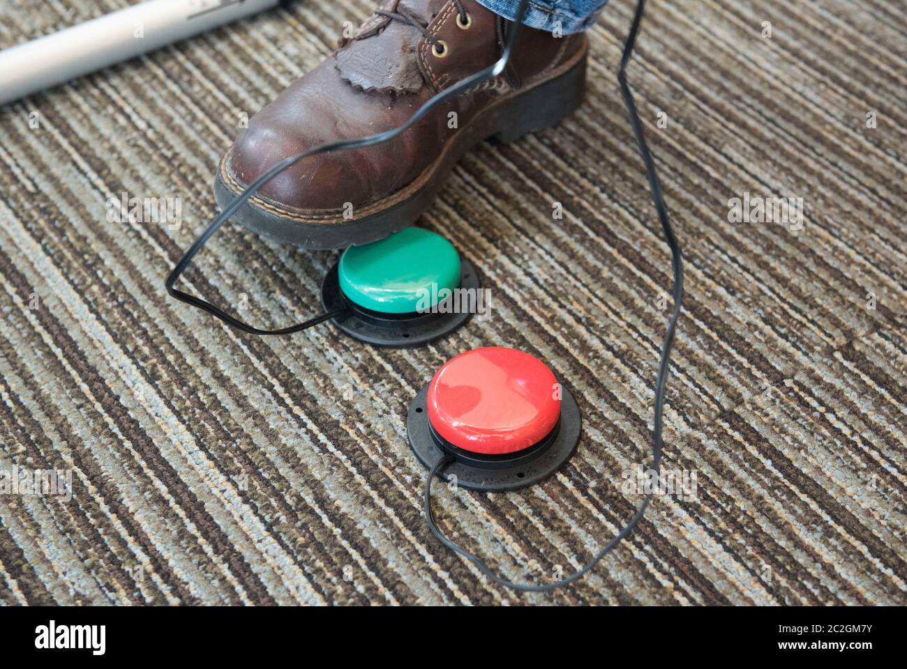 Karnes City, Texas, USA October 26, 2016: An election judge checks 'yes' and 'no' voting pedals on the floor, an accommodation for handicapped voters, at a polling place before voters arrive on the first day of early voting for the general election for president and many other offices. ©Bob Daemmrich Stock Photo