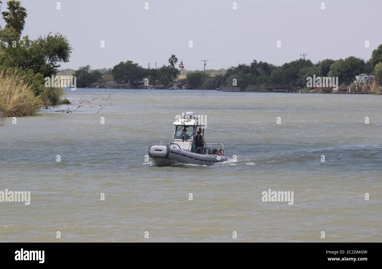 Weslaco, Texas USA, April 12, 2018: U.S. Border Patrol boat patrols the Rio Grande River looking for illegal immigrants crossing from Mexico into the United States. The river forms the international border between the two countries. ©Bob Daemmrich Stock Photo