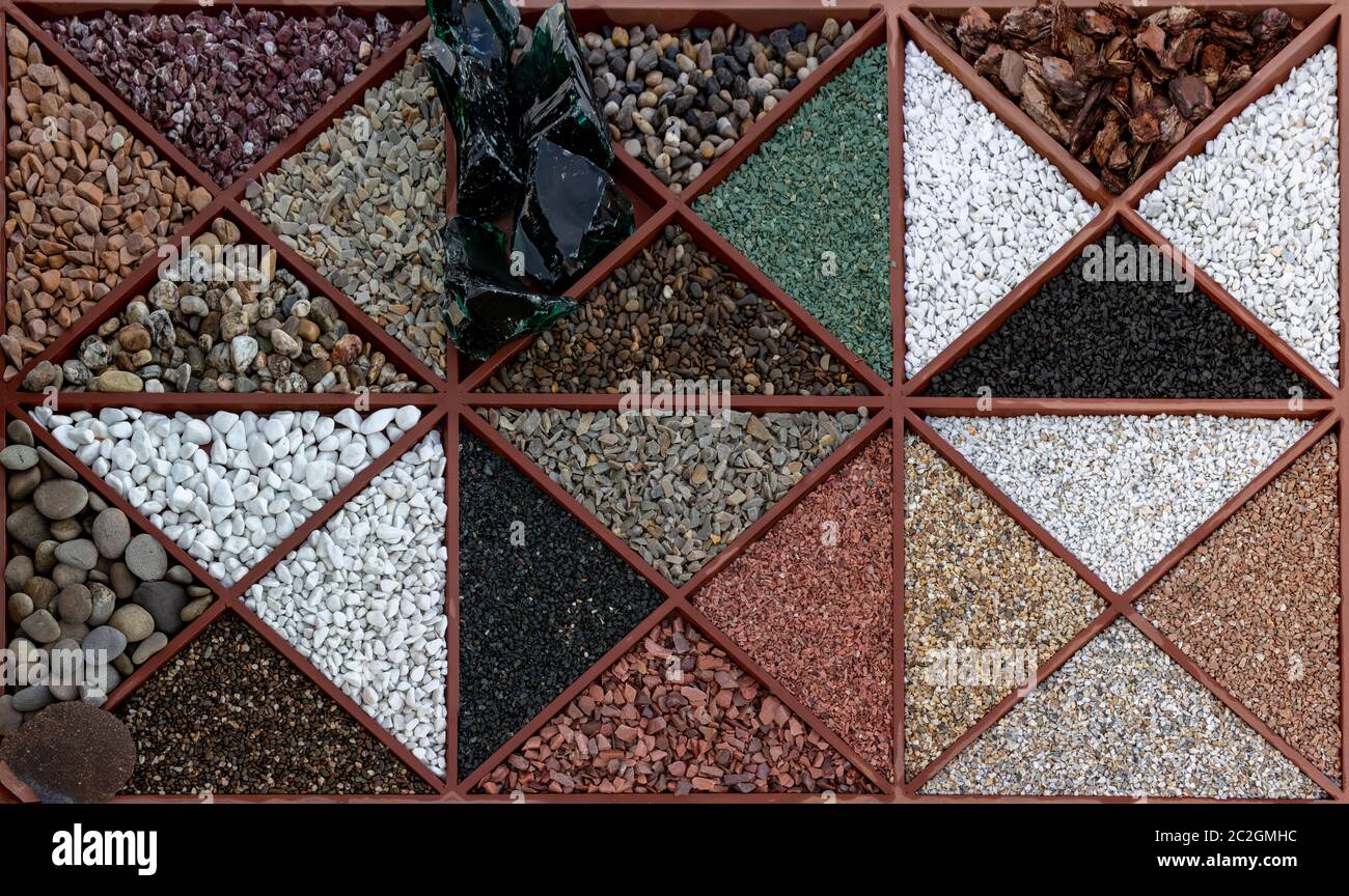 Multicolored samples of marble, granite, and travertine chips and