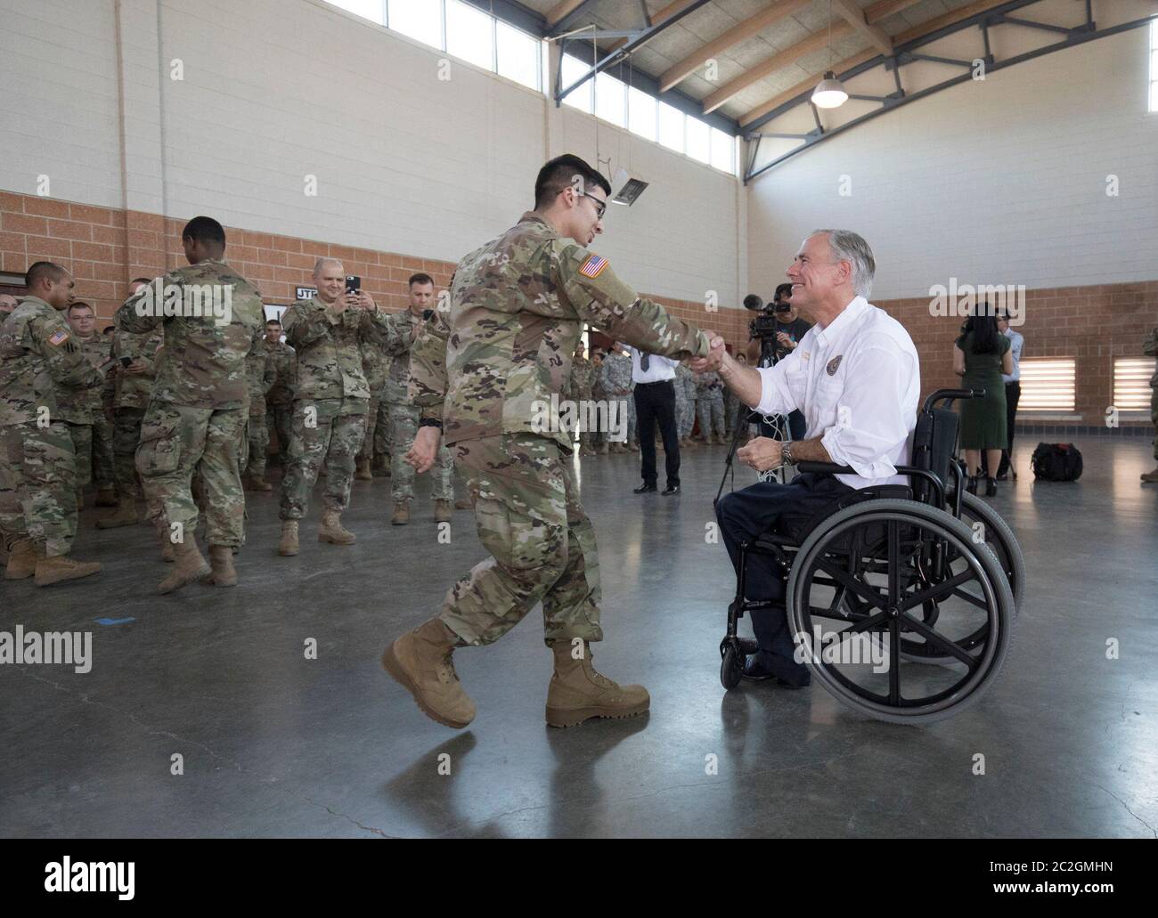 Weslaco, Texas USA, April 12, 2018 Texas Gov. Greg Abbott greets Army National Guard member at