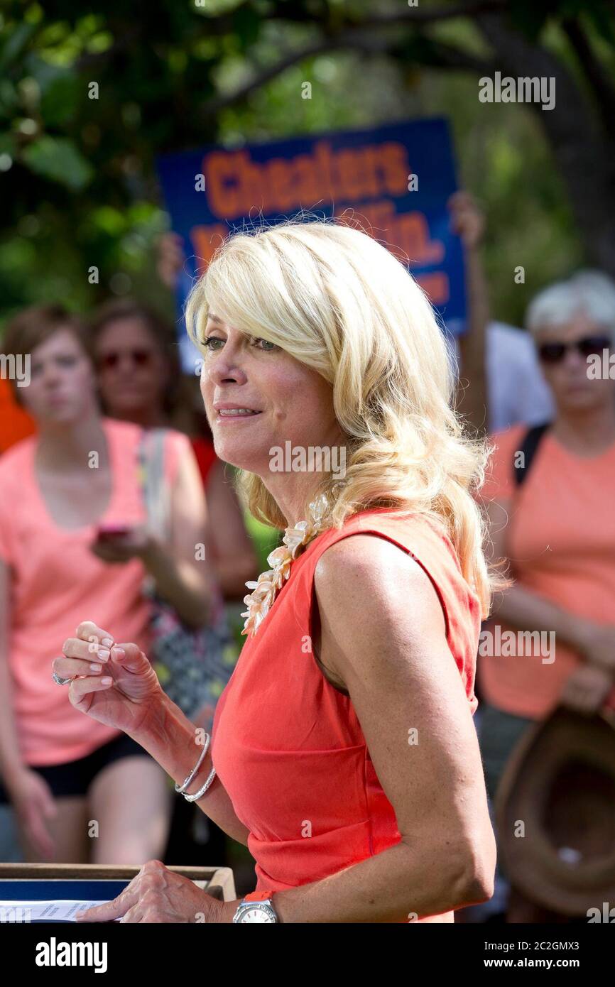 Austin Texas USA, July 2013: State Sen. Wendy Davis, D-Ft. Worth, speaks at a pro-choice rally as activists continue to descend on the Capitol while Texas lawmakers struggle to pass a bill limiting the number of abortion providers by increasing medical standards for clinics to the level of ambulatory surgical centers. ©Bob Daemmrich Stock Photo
