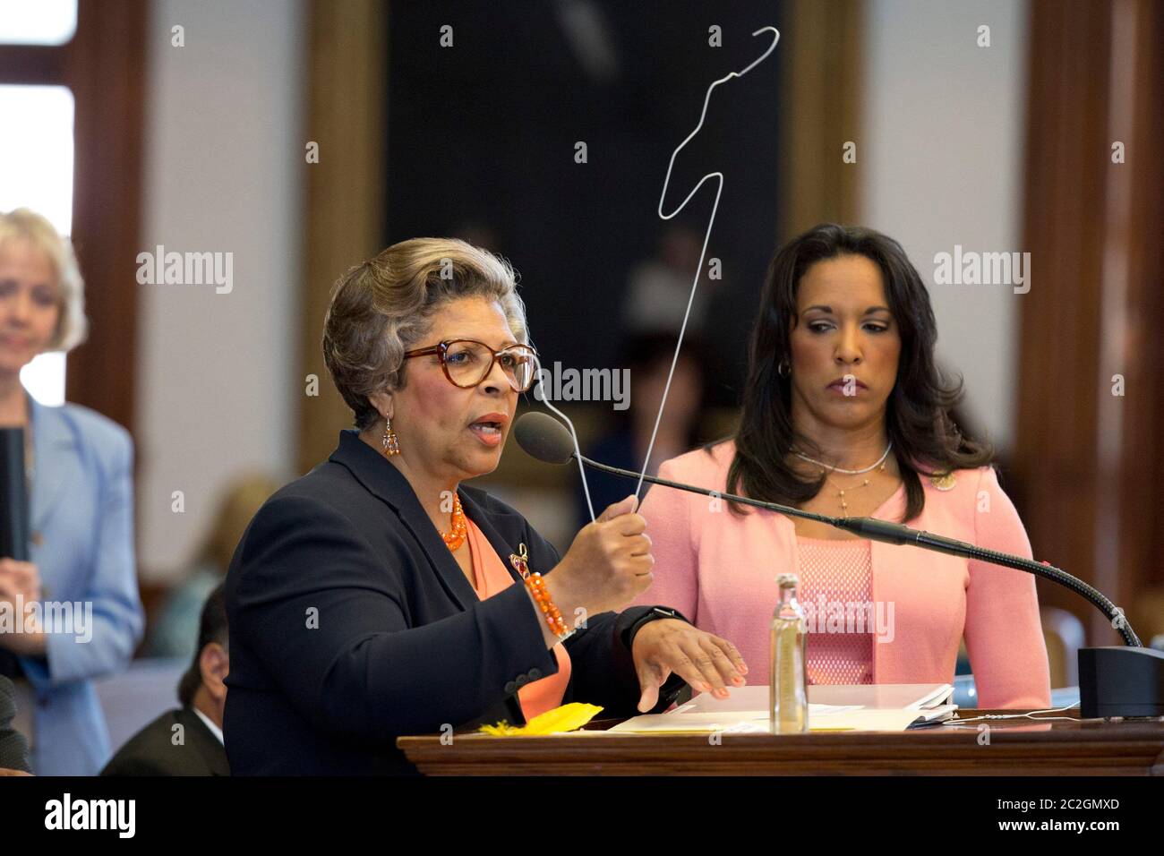 Austin Texas USA, July 10 2013: State Rep. Senfronia Thompson, D-Houston, holds primitive abortion tools--reconfigured coat hangers--as Texas lawmakers struggle to pass a bill that would limit the number of abortion providers by increasing medical standards for clinics to the level of ambulatory surgical centers. ©Bob Daemmrich Stock Photo