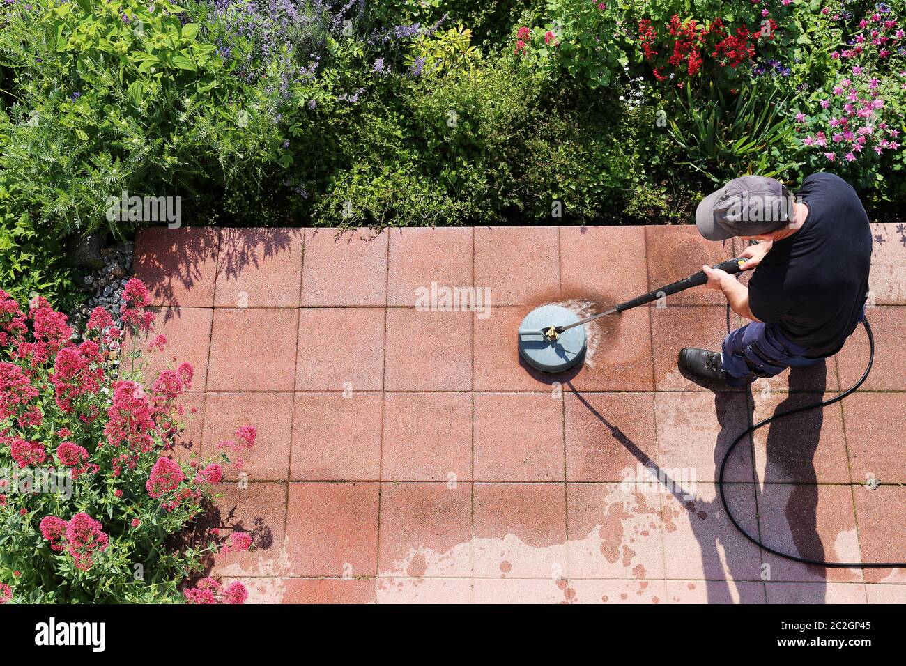 Cleaning stone slabs with the highpressure cleaner Stock Photo Alamy