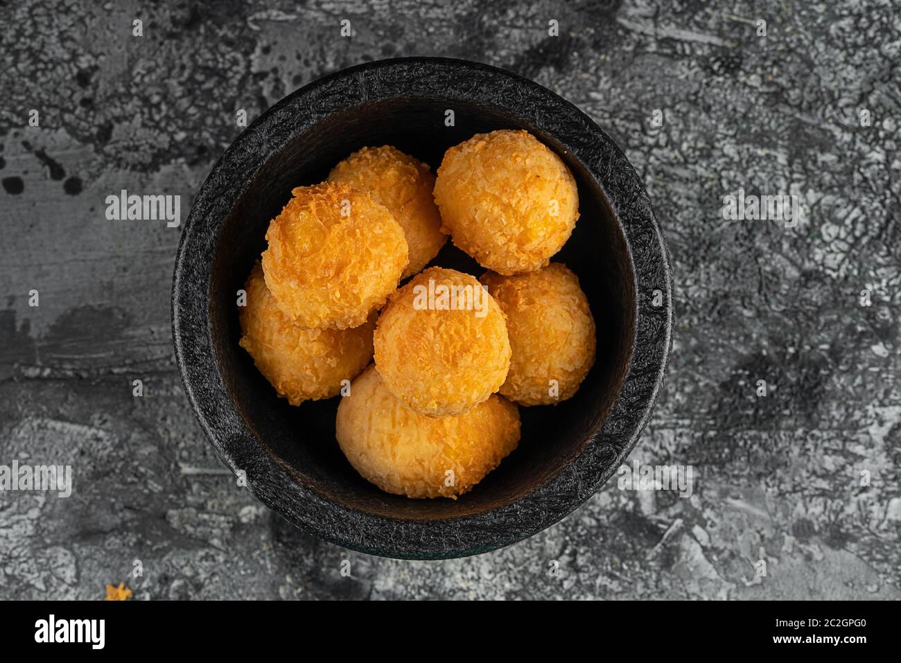 Potato croquettes - mashed potatoes balls breaded and deep fried, served with different sauce. Stock Photo