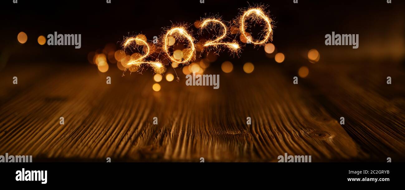 Background for the new year 2020 with old wood and festive golden lights Stock Photo