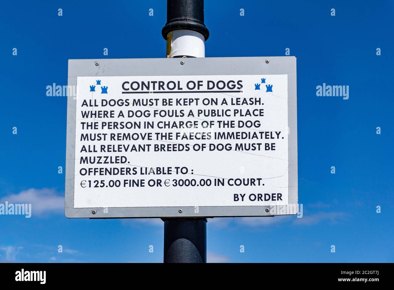 a sign from Dublin City Council warning of the consequences of not keeping your dog on a leash. Stock Photo