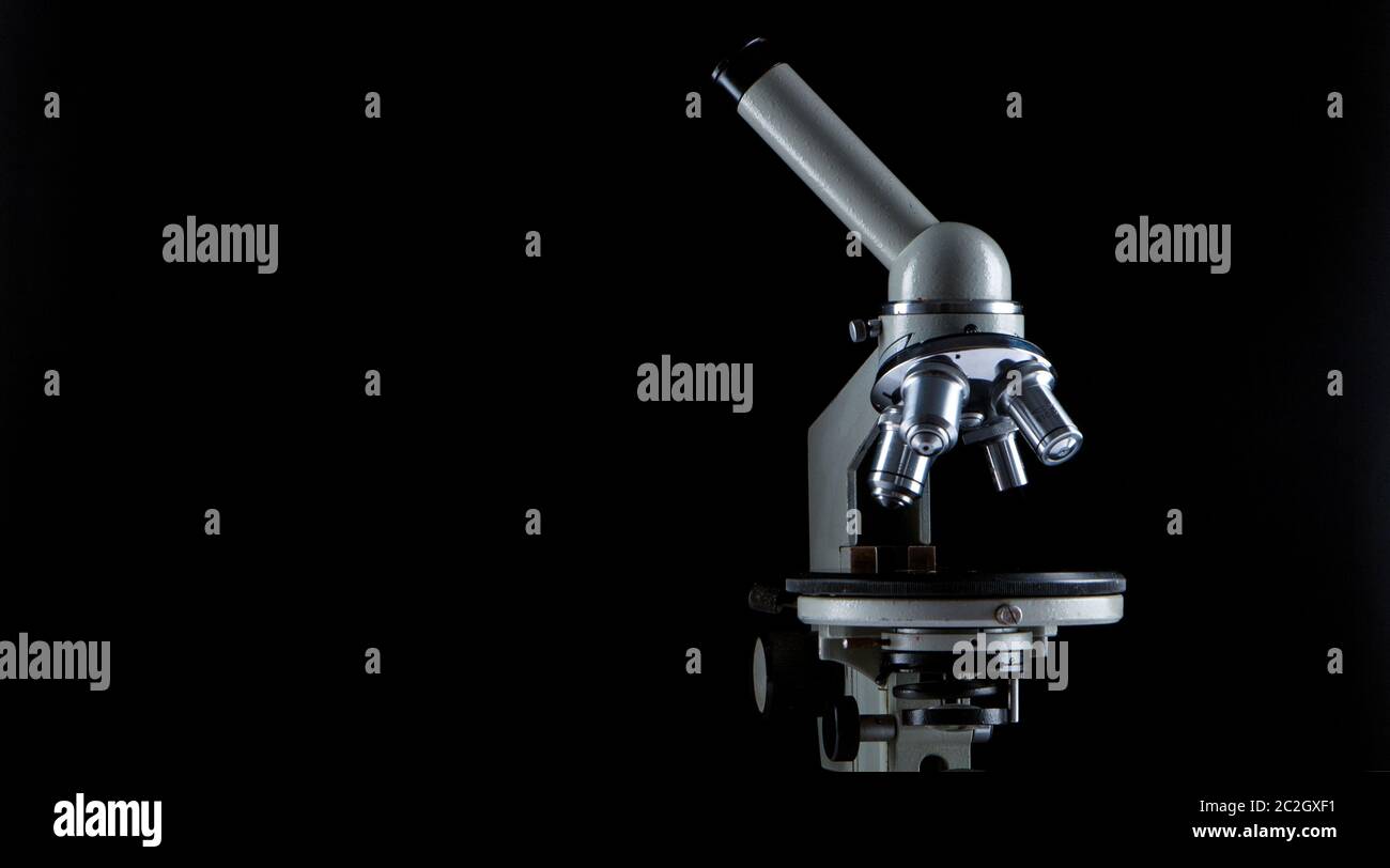 white microscope on dark background. Close up Stock Photo - Alamy