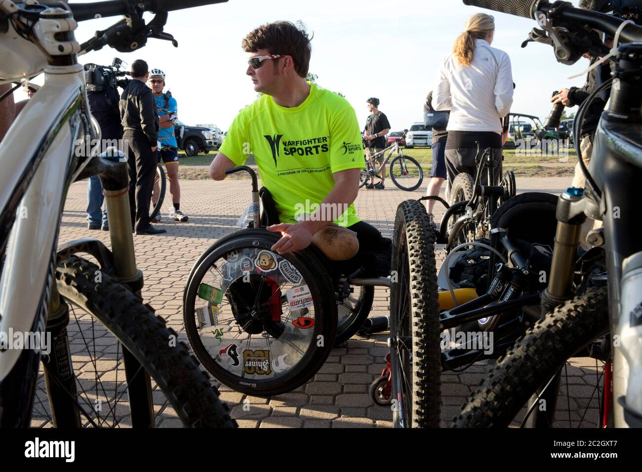 Crawford Texas USA, May 2 2014: Military veteran and amputee Timothy Brown prepares his handicapped-adaptive bike as former president George W. Bush hosts bicycle riders through his Prairie Chapel Ranch in the fourth annual Wounded Warrior 100K. The three-day event featured 17 U.S. soldiers injured in recent combat in Iraq and Afghanistan.   ©Bob Daemmrich Stock Photo