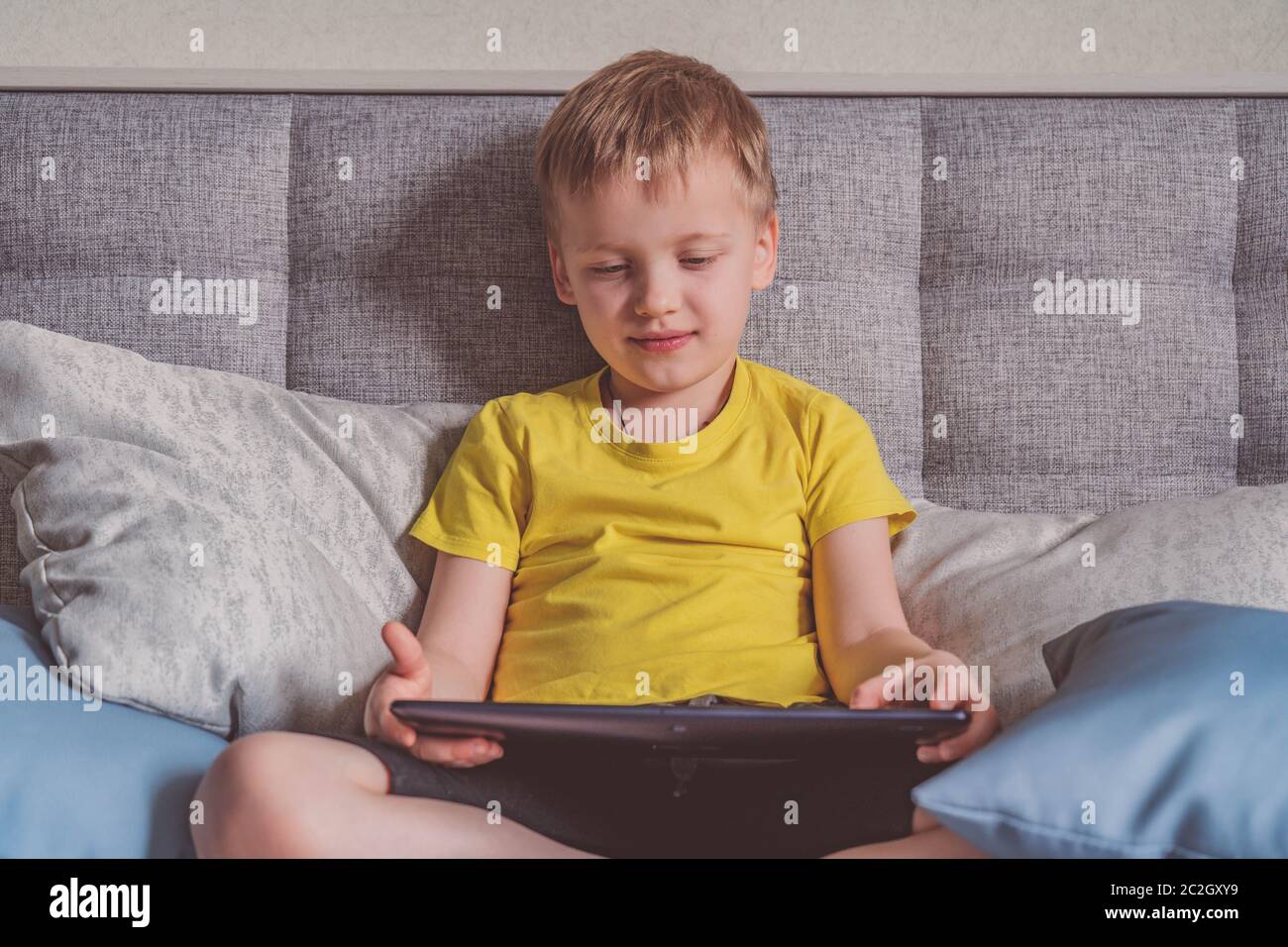 Distance learning online education. Caucasian happy boy with book ...