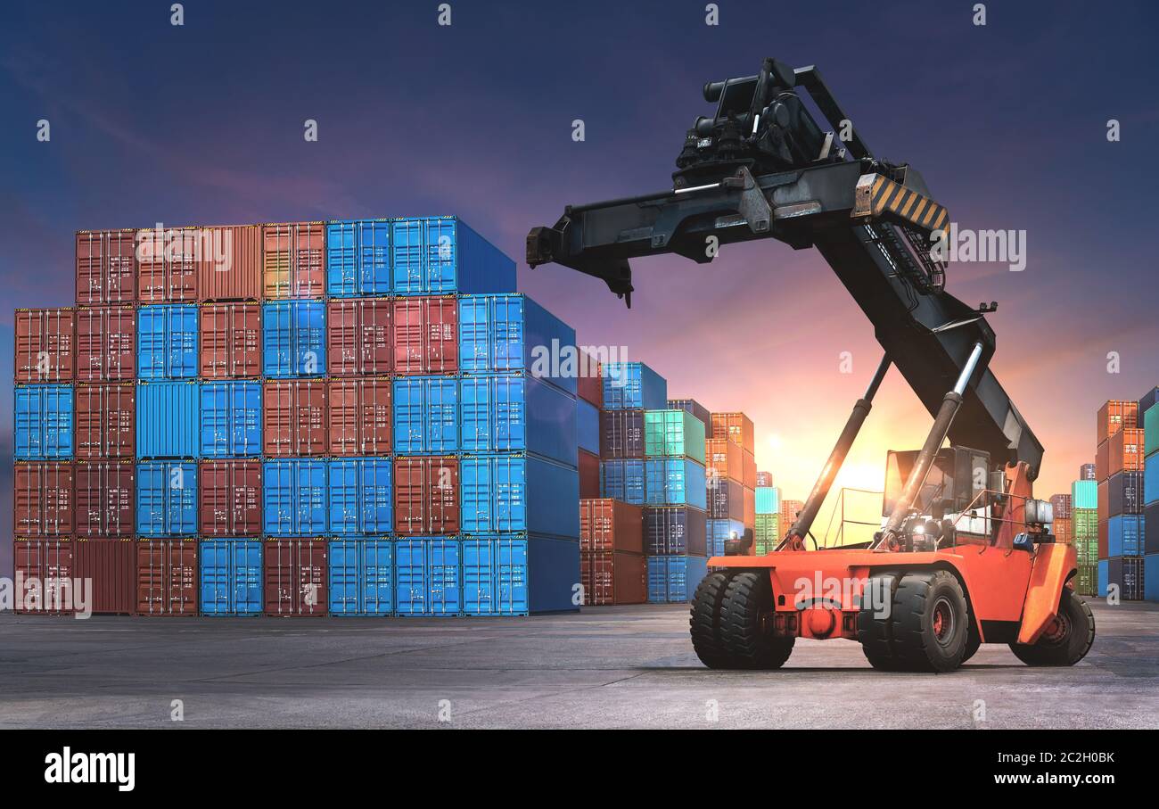 Industrial Containers box from Cargo freight ship for import and export in shipping yard with cargo container stack. Stock Photo