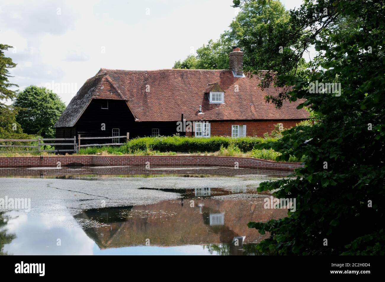 Park Mill at Bateman's, Rudyard Kipling's home from 1902 - 1936. The mill and its pond (seen here) have recently undergone extensive renovations. Stock Photo