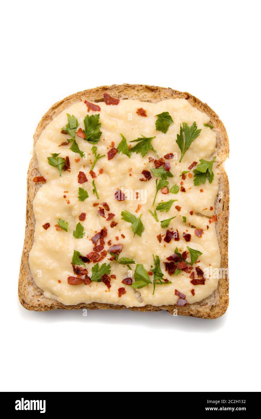 Slice of bread with spread on top isolated over white background Stock ...