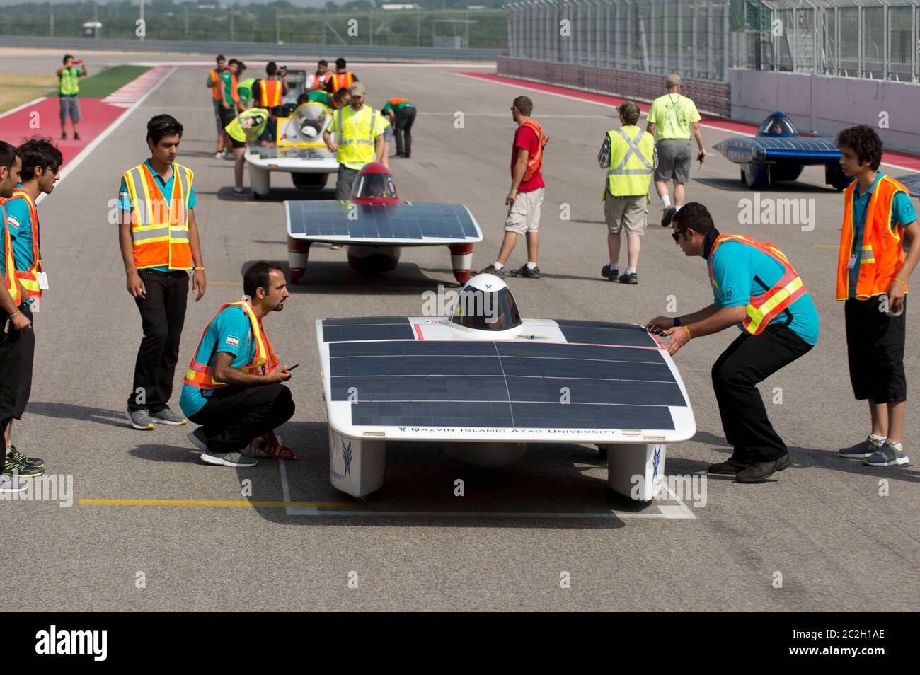 Austin, Texas USA, July 18 , 2014: Iranian students from Qazvin Islamic Azad University ready their car, Havin 2 during qualifying races for the 1,700-mile American Solar Challenge race at Circuit of the Americas racetrack outside Austin. The event features 21 college solar car teams from across the U.S, Canada, Puerto Rico and Iran. ©Bob Daemmrich Stock Photo